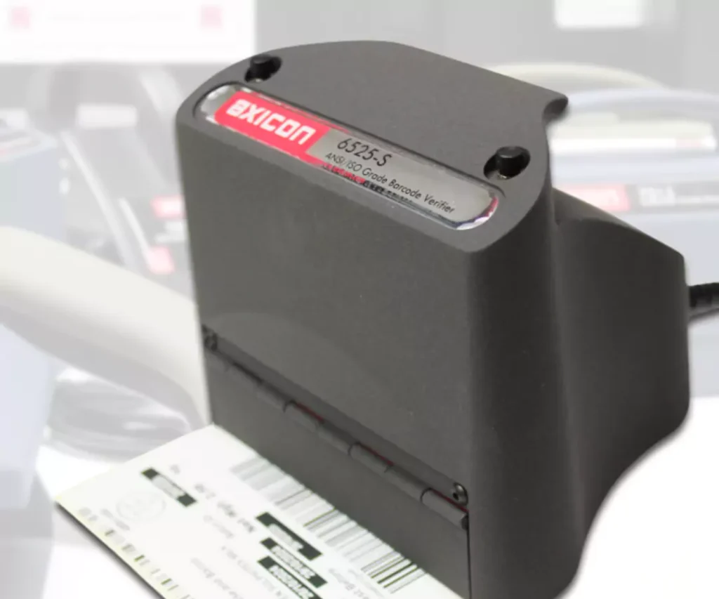Axicon 6525-S barcode verifier scanning a label for ISO barcode verification and reporting.